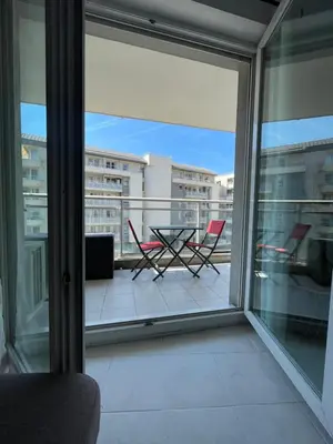 a view of a balcony with a table and chairs at Le soleil Niçois, proche du port in Nice