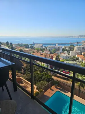 a view of the ocean from the balcony of a condo at L'évidence in Nice