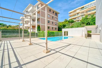 an apartment with a swimming pool in a building at Magnifique 4 pers,Clim,parking in Nice