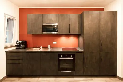 a kitchen with brown cabinets and a sink at 
