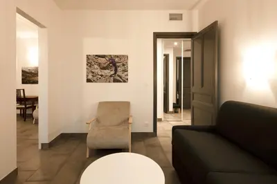 a living room with a couch and a chair at 