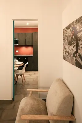a living room with a chair and a table at 