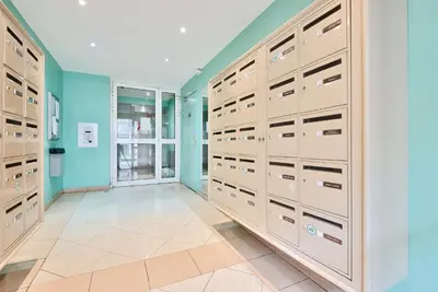 a walk in closet with lockers in a room at 2P balcon Vue Mer YourHostHelper 2 mins de la mer in Nice