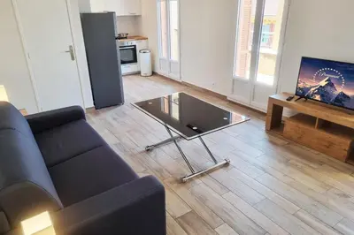 a living room with a couch and a glass coffee table at 