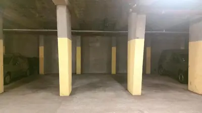 a parking garage with two columns and parked cars at Heliotel Marine Studio avec balcon au 4eme étage à 200m de la mer in Saint-Laurent-du-Var