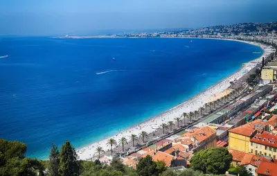 an aerial view of a beach and the ocean at blue sun in Nice