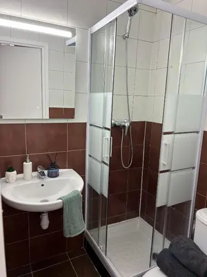 a bathroom with a shower and a sink at blue sun in Nice