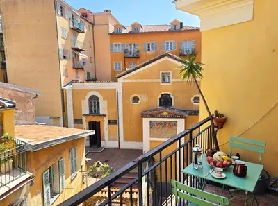 a balcony with a table with fruit on it at 
