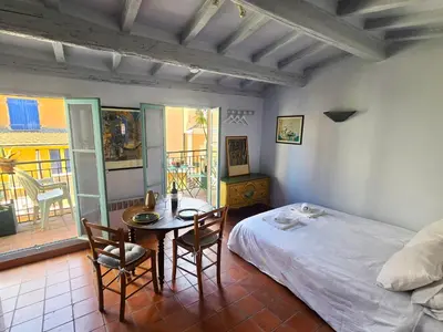a bedroom with a bed and a table and chairs at 