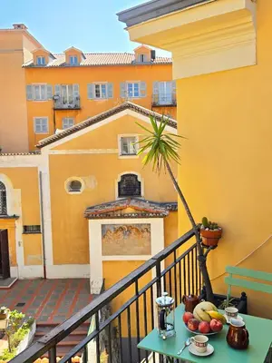 a table with fruit on top of a balcony at 