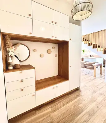 a large white dresser in a living room with a staircase at Villa moderne pour 8 personnes - Vue sur Nice ! in Nice