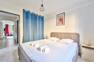 a bedroom with a bed with two towels on it at Modern 2BR Flat - Haut de Nice in Nice