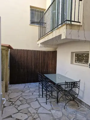 a bedroom with a bed with red curtains in it at Appartement 4 pièces - gare Nice riquier in Nice