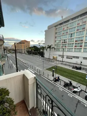 a view of a city street from a balcony at Appartement Californie Beach in Nice