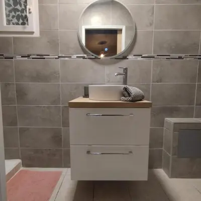 a bathroom with a sink and a mirror at L'olivier in Gattières