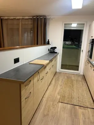 a large kitchen with a counter top and a window at Olympie, airport, train and tram station Fully equipped for 3 peoples in Nice