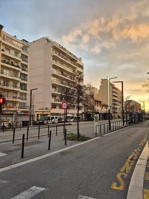 an empty street in a city with buildings at Appartement à 2 pas de la Promenade des Anglais vue mer 7 avenue de Fabron in Nice