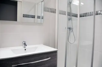 a bathroom with a sink and a shower at Apartment Massena in Nice