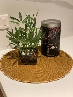 a can of coffee and a plant on a table at APPARTEMENT en DUPLEX VIEUX NICE in Nice