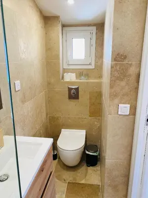a bathroom with a toilet and a sink at APPARTEMENT en DUPLEX VIEUX NICE in Nice