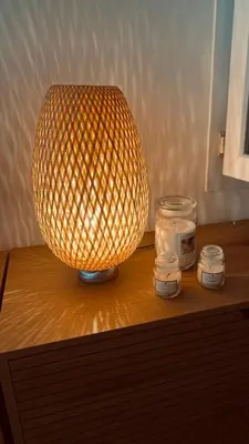 a lamp sitting on top of a table with candles at APPARTEMENT en DUPLEX VIEUX NICE in Nice