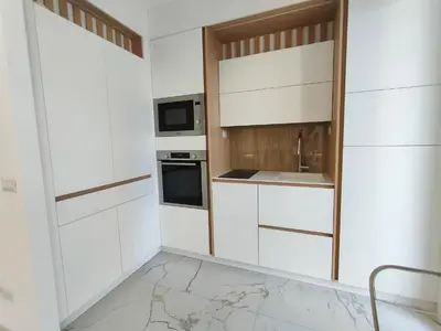 a kitchen with white cabinets and a sink at France 105 Super Centrale 2 Pers WiFi AC in Nice