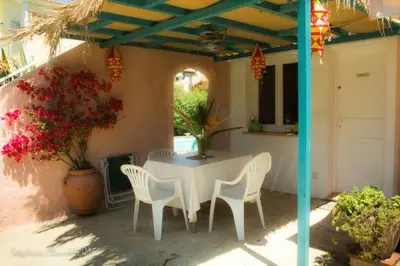 a white table and chairs on a patio at Rez de Jardin Villa Cagnes Sur Mer. in Cagnes-sur-Mer
