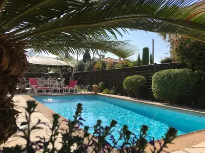 a swimming pool in the backyard of a house at Rez de Jardin Villa Cagnes Sur Mer. in Cagnes-sur-Mer