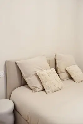 a bedroom with a large rock hanging on the wall at Cosy moon for 4 or 6 people quartier du Port in Nice