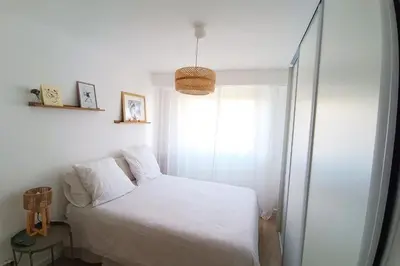 a bedroom with a white bed and a window at 2-rooms apartment with Wifi and balcony in Nice