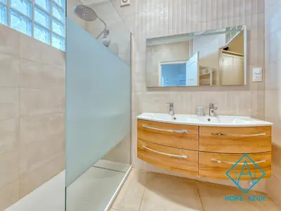 a bathroom with a sink and a mirror at Golden Square in Nice