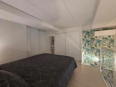 a bedroom with a bed and a wall mural at Carré d'Or Star Loft in Nice