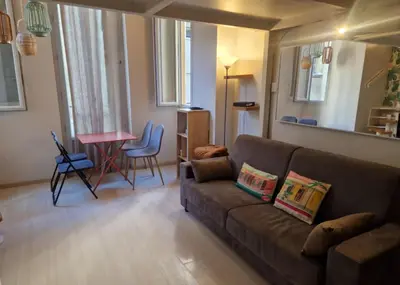 a living room with a couch and a table at Carré d'Or Star Loft in Nice