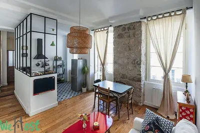 a kitchen with a counter and a window at WeHost Phillibert - L'Ecrin Vintage So NICE in Nice
