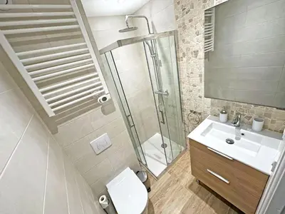 a bathroom with a shower and a toilet and a sink at Stunning Studio Rue France Promenade des Anglais in Nice