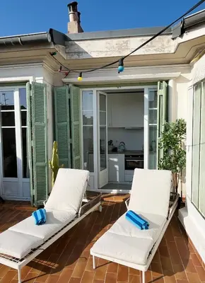 a living room with a flat screen tv on a wall at Exclusive Top Floor - Love Suite in Nice