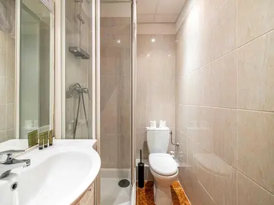 a bathroom with a toilet and a sink and a shower at Superb 2 room apartment in the heart of Nice in Nice
