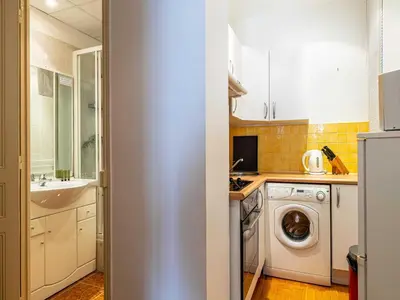 a kitchen with a sink and a washing machine at Superb 2 room apartment in the heart of Nice in Nice