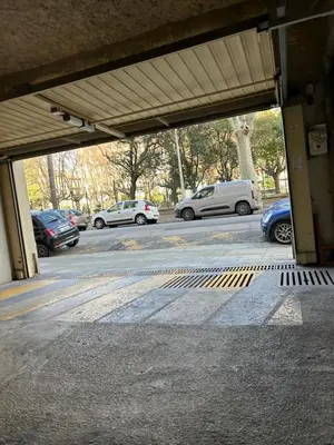 a parking lot with cars parked in a parking lot at Superbe appartement Port de Nice Lumineux,Clim , Parking in Nice