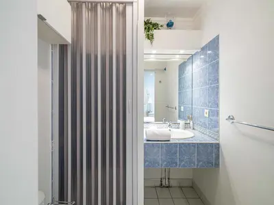 a bathroom with a tub and a sink at Studio with balcony & pool -Heart of Nice in Nice