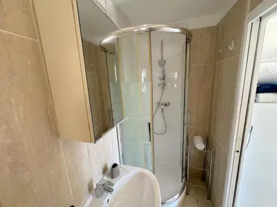 a bathroom with a sink and a shower at ⁂ Studio cosy 3 min de la plage terrasse clim in Nice