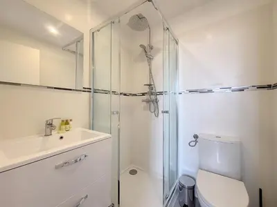 a bathroom with a shower and a toilet and a sink at Nestor&Jeeves - VIEUX NICE DUPLEX - Studio - Central in Nice