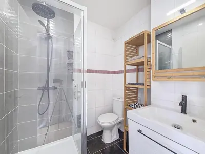 a bathroom with a shower and a toilet and a sink at Studio toit terrasse vue mer Sea View in Nice
