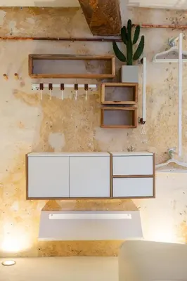 a living room with white furniture and a cactus at Studio29 in Nice