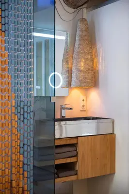 a bathroom with a sink and a glass shower at Studio29 in Nice
