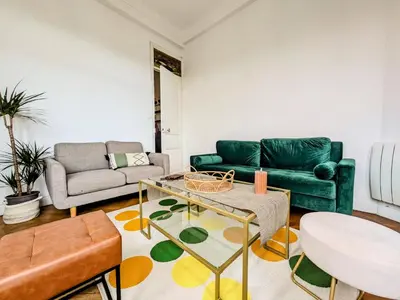 a living room with a couch and a table at Cosy appartement in Nice city center in Nice