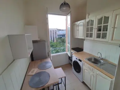a small kitchen with a sink and a window at Cosy appartement in Nice city center in Nice