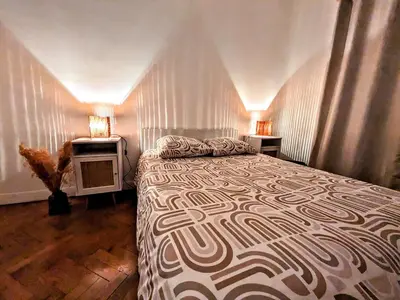 a bedroom with a bed and a tv in it at Cosy appartement in Nice city center in Nice