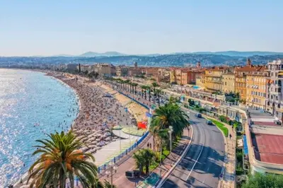 a city with a beach and the ocean and buildings at Le Jasmin - Au Coeur de Nice in Nice