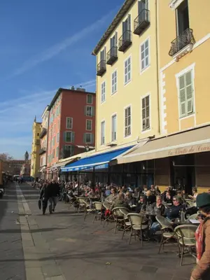 a group of people sitting in chairs on a street at Nice Studio Old Town Sea Side in Nice